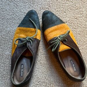 All Black brand in real cow skins brown and orange with sage lace. comfortable.